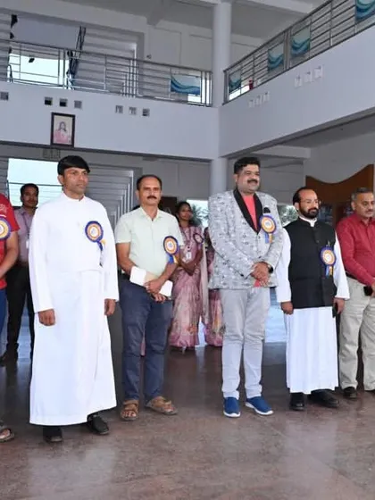 Standing with the other guests on the school premises before the main event began.