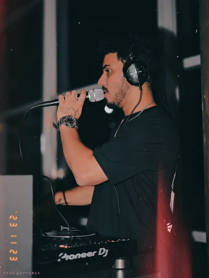 On the mic at Playboy, Gurgaon. I don't just play music; I interact with the crowd, hype them up, and make sure everyone feels like part of the show.