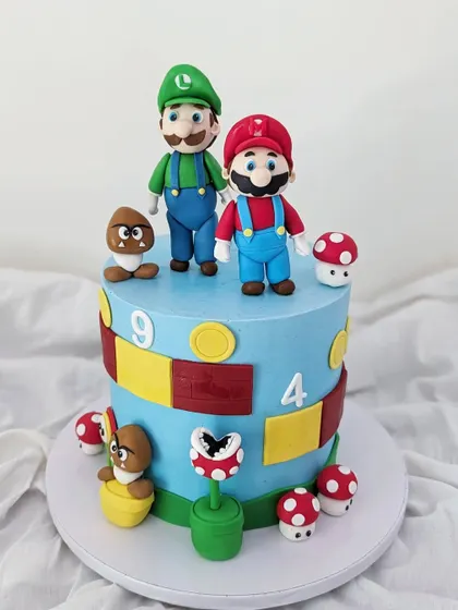 It's-a-me, Mario! This Super Mario cake was so much fun to make, bringing back memories of playing the game. It features Mario, Luigi, and other iconic elements.