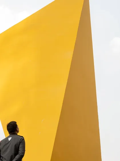 "Yello" is a 35-foot art installation we designed for a tech building in Hyderabad. We believe art should be integrated into the narrative of the built environment, and this piece was conceived as a central part of the landscape, not an afterthought.