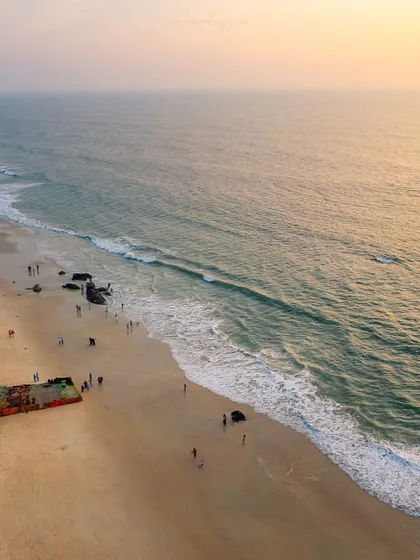 An aerial shot of a shipwreck off the coast of Padubidri. This blue flag beach holds a surprising piece of history, now a point of interest for visitors.