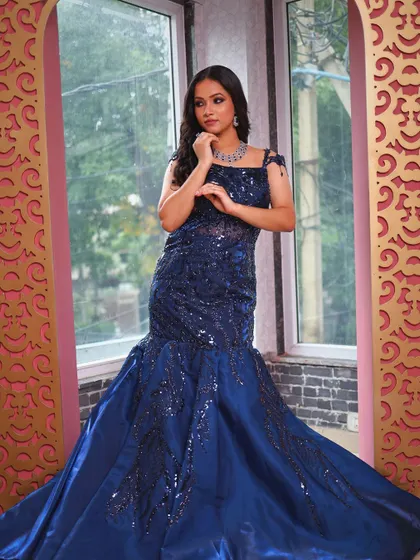 A final full-length view of the stunning blue fish-cut gown.