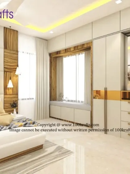 This bedroom showcases a beautiful wardrobe with gold accents and a cozy window seat. The combination of white, gold, and wood creates a glamorous and comfortable space.