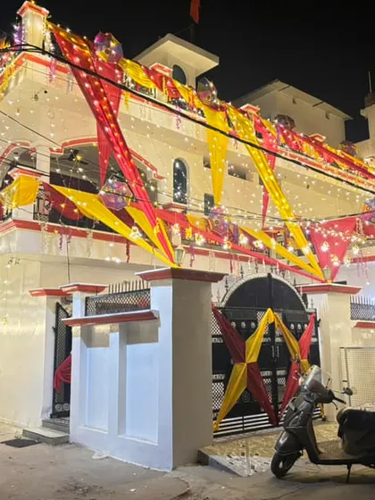 This is the 'shaadi wala ghar' look that I am known for. I can transform the entire exterior of your house with lights and colourful fabric draping to create a festive and welcoming atmosphere for your wedding celebrations.