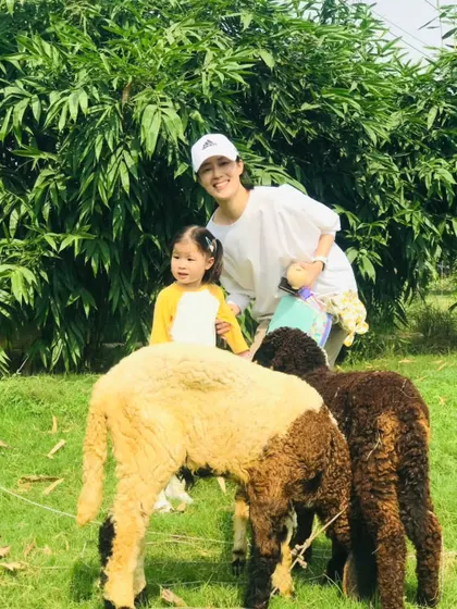 A mother and daughter enjoying a moment with our sheep. Feeding the animals is a highlight for many of our young visitors, teaching them kindness and respect for other living beings.