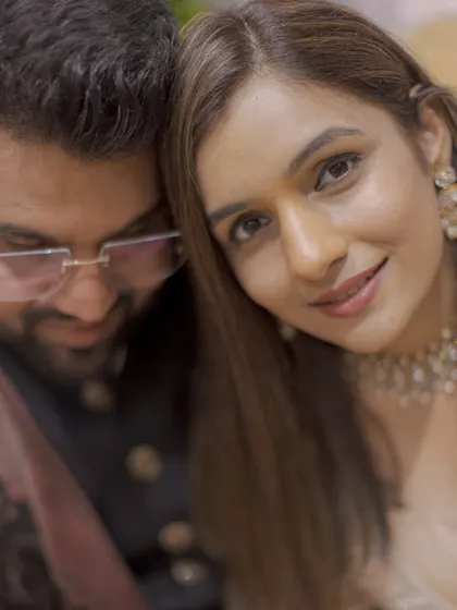 A soft and intimate close-up from an engagement shoot, capturing the couple's gentle connection and the bride's beautiful smile.