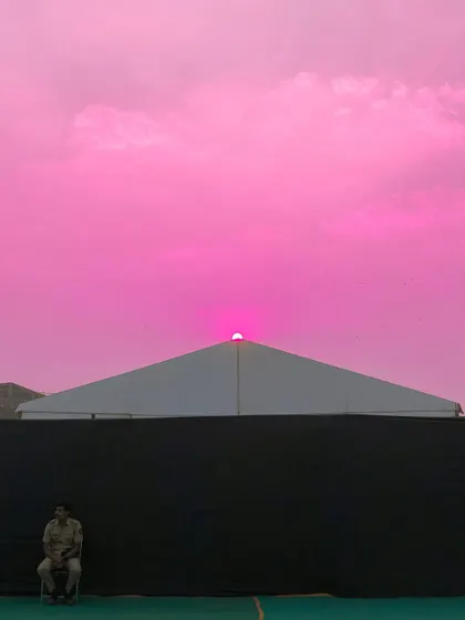 A final, vibrant edit of the sunset scene, with the sky rendered in a shocking, solid pink.