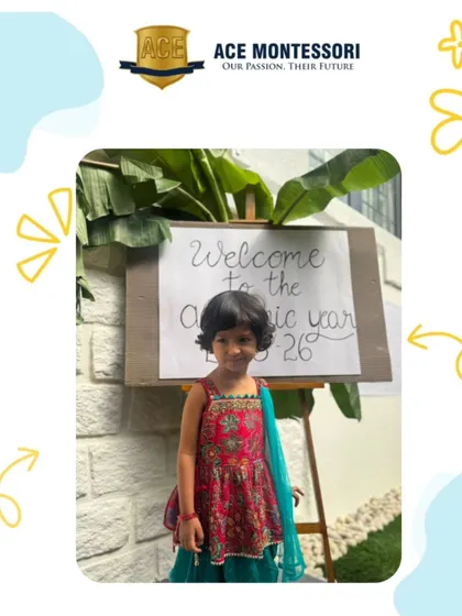 A student dressed in traditional attire poses by our "Welcome" sign on the first day of the academic year. We start every year with a festive and positive spirit.