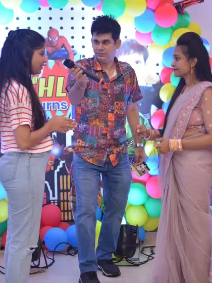 Engaging with the parents during a superhero-themed birthday party. Fun for the whole family!