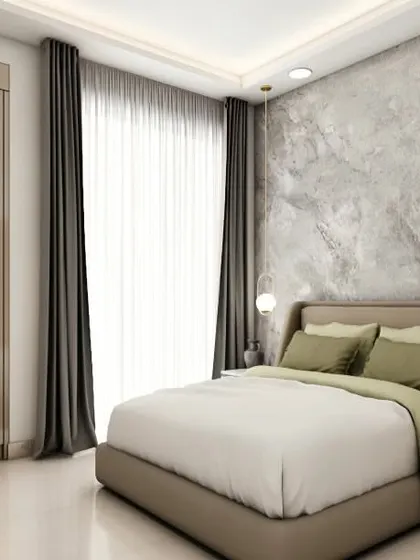 A simple yet chic bedroom with a textured grey accent wall behind the bed. The combination of earthy green bedding and neutral tones creates a restful and natural feel.