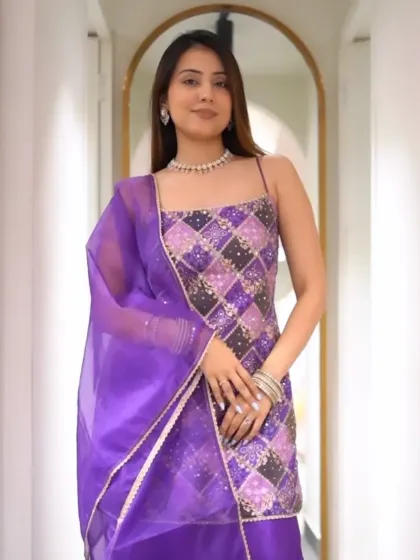 One word for this look? Regal. This purple sharara suit with intricate silver embroidery and a strappy neckline is absolutely stunning.