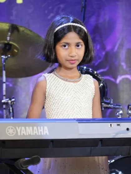 A collection of photos from our keyboard ensemble's performance of 'Chand Sifarish'. These shots capture the focus and joy of our young musicians and their teachers on stage.