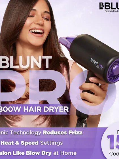 An advertisement for the BBlunt Pro Hair Dryer. The image captures the power of the tool with the model's hair blowing, supported by text explaining its ionic technology and heat settings for a salon-like blow dry.