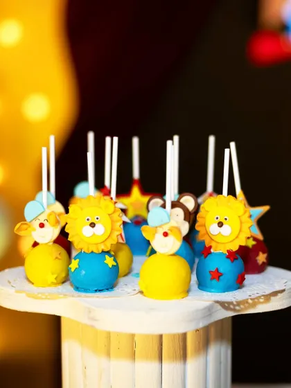 Adorable lion-themed cake pops for a carnival party. These sweet treats are a perfect example of how I carry the theme through every detail, including the food.