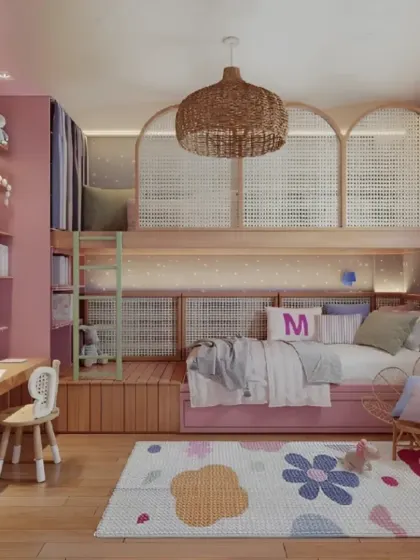 A charming loft bed design in shades of pink and natural wood. The unit includes a desk area, open shelving, and uses rattan panels to add a touch of bohemian style.