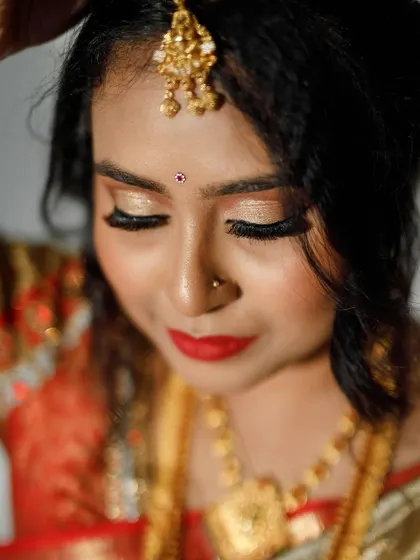 A detailed shot of the glittery gold eyeshadow, a popular choice for brides who want a touch of sparkle.