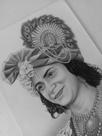 A close-up view of my completed pencil portrait of Lord Krishna, showcasing the detailed work on his turban and jewelry.
