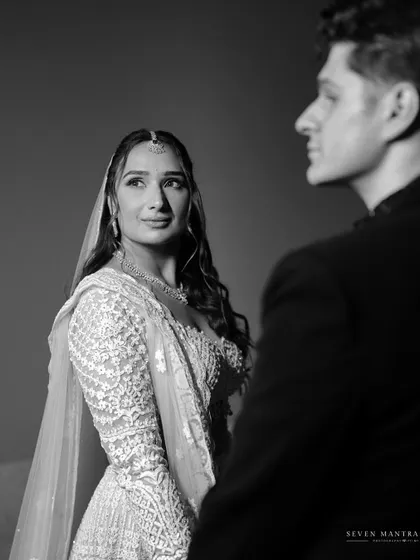 The look of adoration. This black and white close-up focuses on the bride's expression as she looks at her groom, a moment of pure emotion.