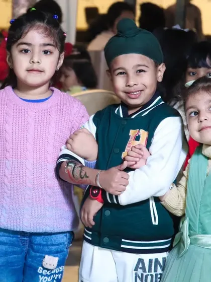 A group of young friends posing for a photo at a birthday party. We love capturing the friendships and fun that kids share at parties.
