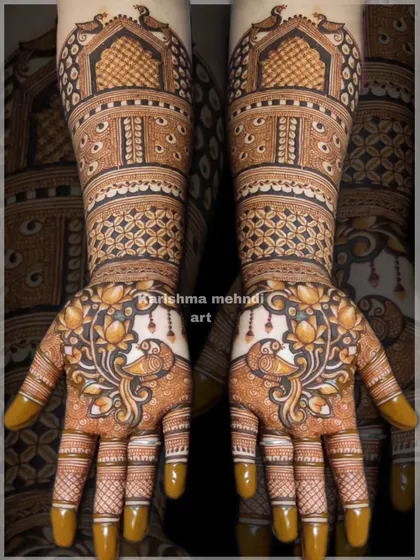 A beautiful design featuring peacocks surrounded by lotus flowers on the palms. The arms are adorned with traditional jharokha windows and geometric patterns, creating a rich and detailed look.