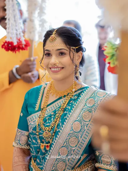 A beautiful portrait of the bride during her wedding rituals. The soft lighting highlights her glowing skin, traditional jewelry, and the elegant drape of her saree.