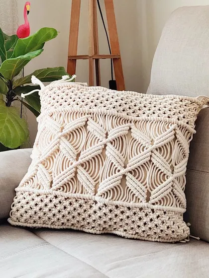 A single macrame cushion cover can be a statement piece on its own.