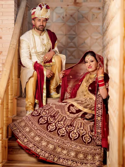 A royal portrait of the bride and groom in their stunning wedding attire. I use classic poses and settings like this staircase to create elegant and timeless wedding photographs.