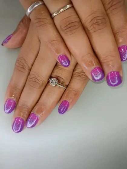 A bright and shimmery purple and pink ombre set, perfect for someone who loves bold, glittery colors.