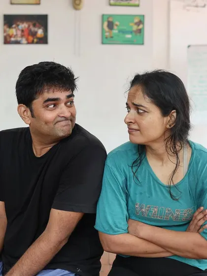 A candid moment between the two actors of "Gretel" during a break in rehearsals.