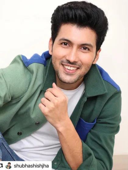 A smiling shot of Shubhashish Jha, showcasing a classic and clean men's haircut.
