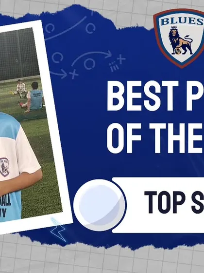 This young player proudly displays his medal after being named Best Player of the Week. His consistent effort is an inspiration to his teammates.