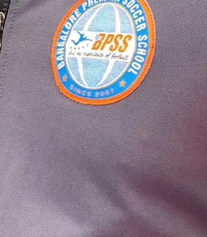 A close-up of the BPSS logo on our official tracksuit, a symbol of the quality and professionalism I stand for.