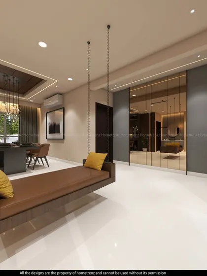 A view of the open-plan living and dining area, featuring a comfortable indoor swing. The consistent flooring and neutral wall colors create a seamless flow between the different functional zones.