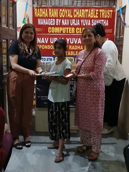 Presenting a student with her new school supplies. The smile on her face is the ultimate reward for our community outreach initiatives.