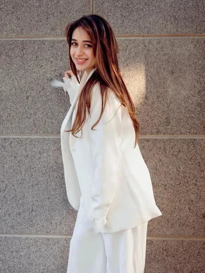 Another shot of this happy client in her white suit, showing how a great outfit can make you shine.