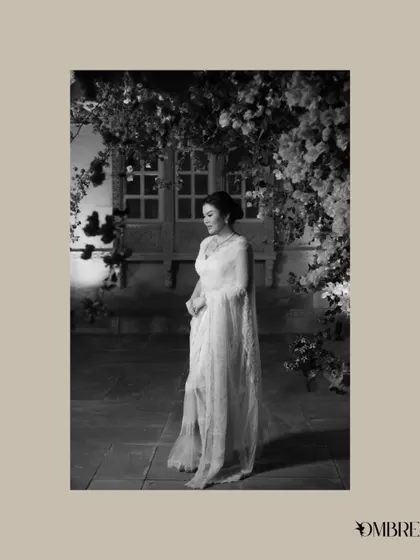 A timeless, black and white portrait of the bride, framed by a beautiful arch of bougainvillea.