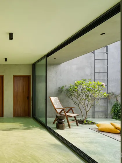 A seamless transition to a small, private courtyard garden. We use large glass sliders to dissolve the boundary between the interior and exterior, allowing the living space to extend outwards and embrace the natural elements.