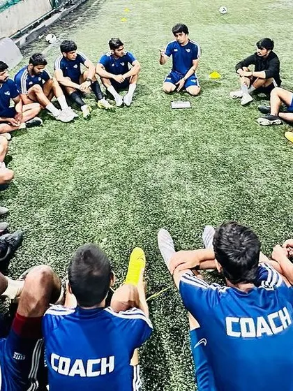 More images showcasing our dedicated coaching team during their own training sessions, meetings, and practice games.