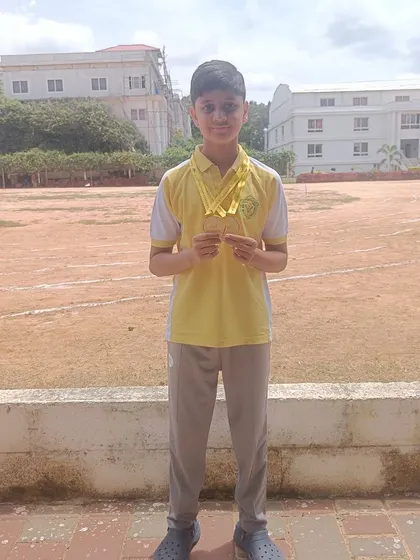 Shashwat shows off his two gold medals in 25m Freestyle and 25m Backstroke from the Candor Swimming Competition.