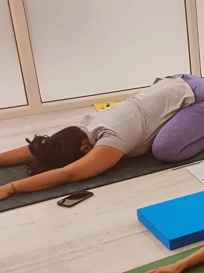 A student practices a child's pose, or shell stretch, during a break in our training. We teach the importance of balancing intense work with restorative movements.