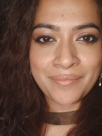 A happy, smiling shot. This shows that even a glamorous makeup look can feel natural and let your personality shine through.