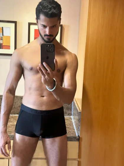 A mirror selfie showcasing my physique in black underwear. This is a standard shot for fitness and underwear modeling portfolios.