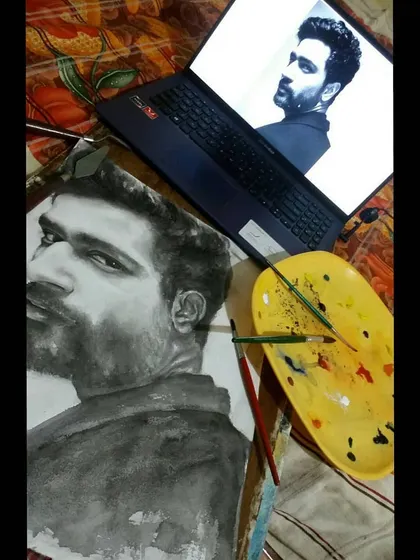 A behind-the-scenes look at my workspace while painting a monochrome watercolor portrait of actor Vicky Kaushal.