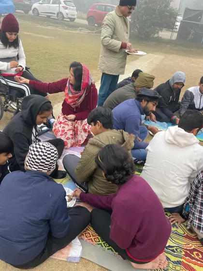 Our members sharing a meal together during the New Year's Hawan Pooja. These moments of community gathering are just as important as our time on the shooting line.