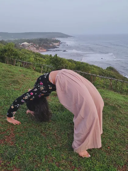 Moving into Chakrasana, or wheel pose, with the ocean as my backdrop. This powerful backbend opens the heart and energizes the entire body.