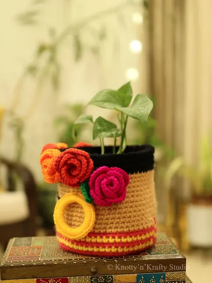 A side view of the bold and beautiful Frida Basket. You can see the colourful roses and the striped details that make this piece so special.