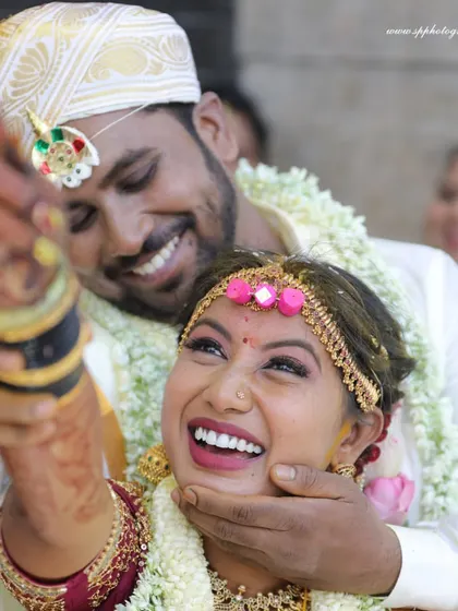 Pure, unadulterated joy. This candid shot of the couple laughing during their ceremony is a perfect example of the real moments we strive to capture.