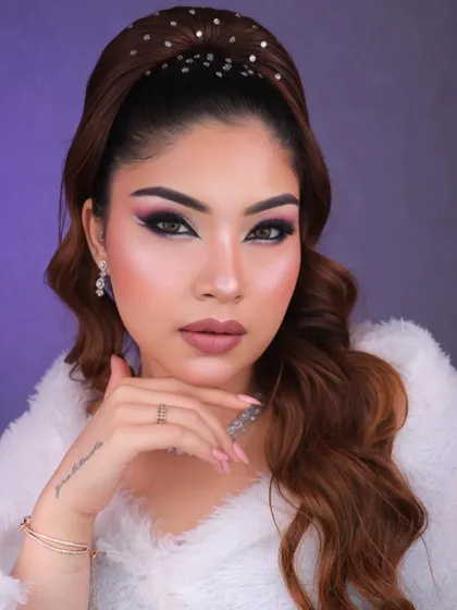 A confident and chic pose, highlighting the overall glamorous and fashionable vibe of the look.
