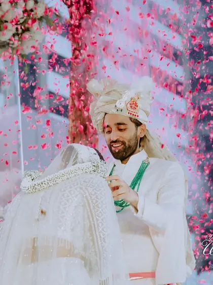 A shower of petals during the Varmala exchange, adding a touch of magic and celebration.