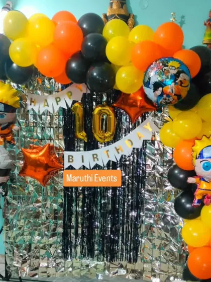 For the anime fans, a Naruto-themed 10th birthday party. This setup uses the show's signature orange and black colors, with character balloons and a silver foil curtain.